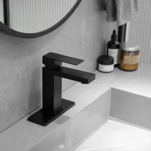 Black square bathroom faucet installed on a gray vanity sink